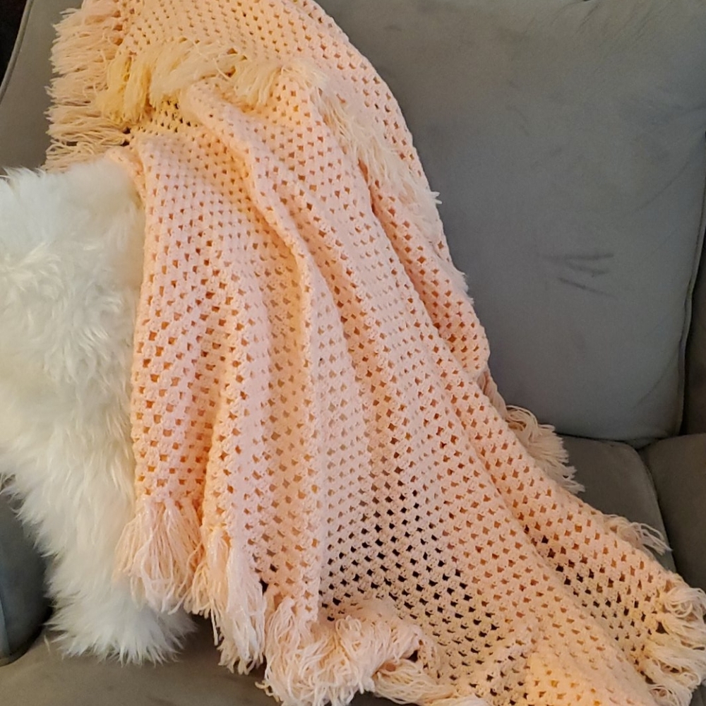 Pink handmade tasseled afghan
